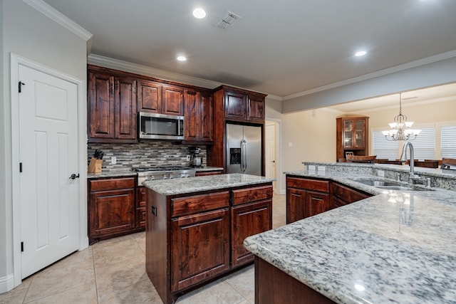 2687 Mcclendon Rd, Weatherford, TX 76088 - kitchen featuring stainless steel appliances, crown molding, tasteful backsplash, a center island, and pendant lighting