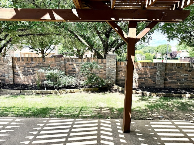 view of patio featuring fence and a pergola