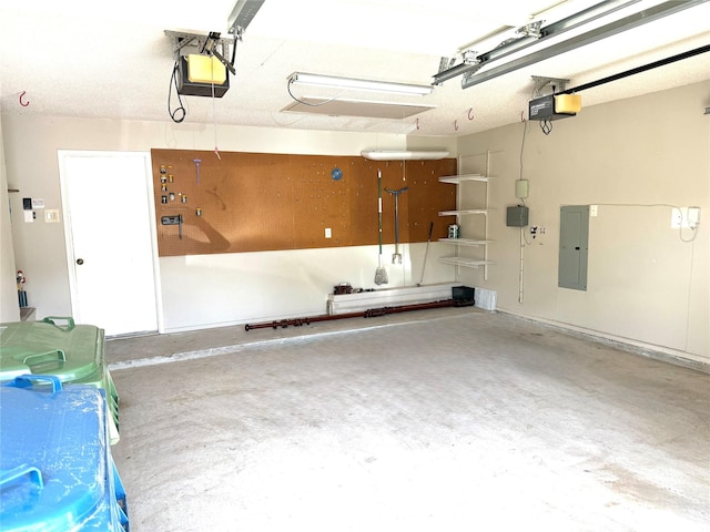 garage with a garage door opener and electric panel