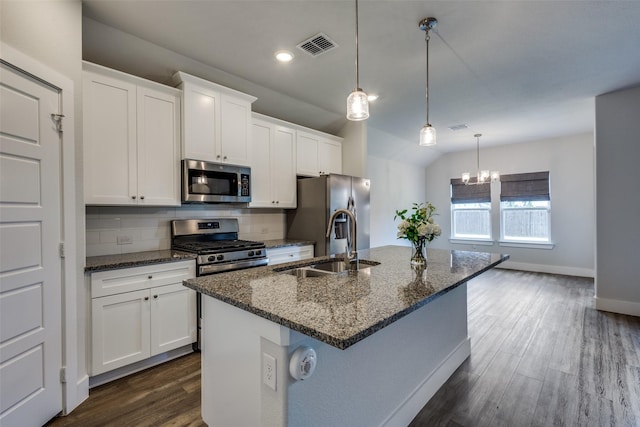 611 Kyle Dr, Tioga, TX 76271 - kitchen with appliances with stainless steel finishes, a sink, a kitchen island with sink, dark wood-style floors, and white cabinets