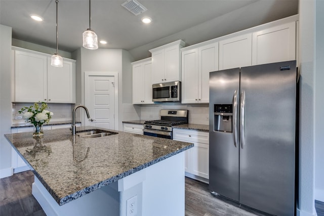 611 Kyle Dr, Tioga, TX 76271 - kitchen with stainless steel appliances, a sink, dark wood finished floors, decorative backsplash, and recessed lighting