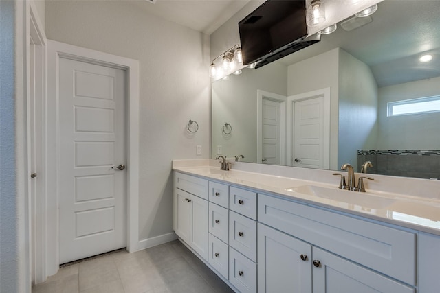 611 Kyle Dr, Tioga, TX 76271 - full bath with double vanity, tile patterned flooring, and baseboards