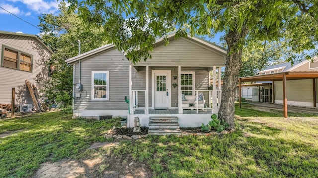 view of front of home featuring covered porch and a front yard