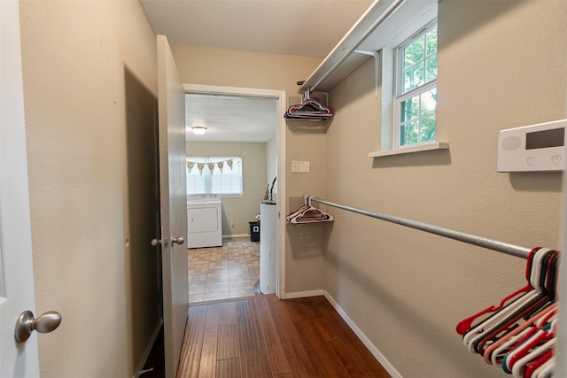 237 Ben Lacy Dr, Gun Barrel City, TX 75156 - spacious closet featuring washer / dryer and dark wood finished floors