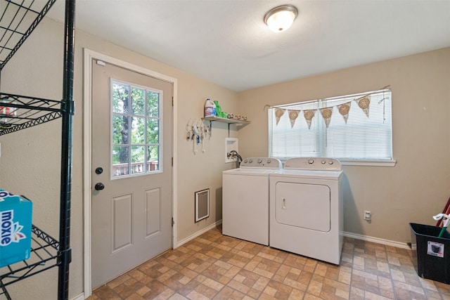 237 Ben Lacy Dr, Gun Barrel City, TX 75156 - laundry room featuring washing machine and dryer, brick patterned floors, and baseboards
