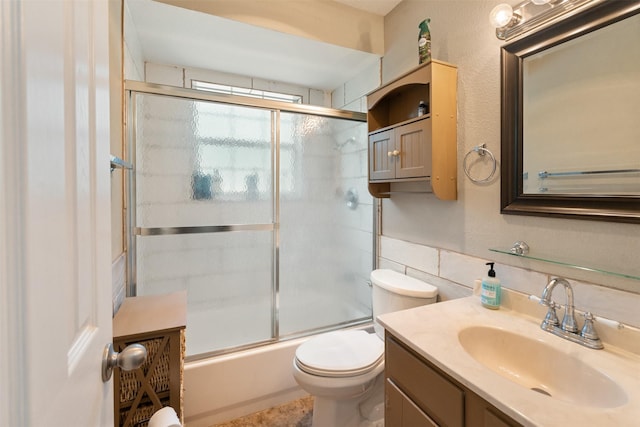 237 Ben Lacy Dr, Gun Barrel City, TX 75156 - bathroom with toilet, vanity, tile walls, and enclosed tub / shower combo