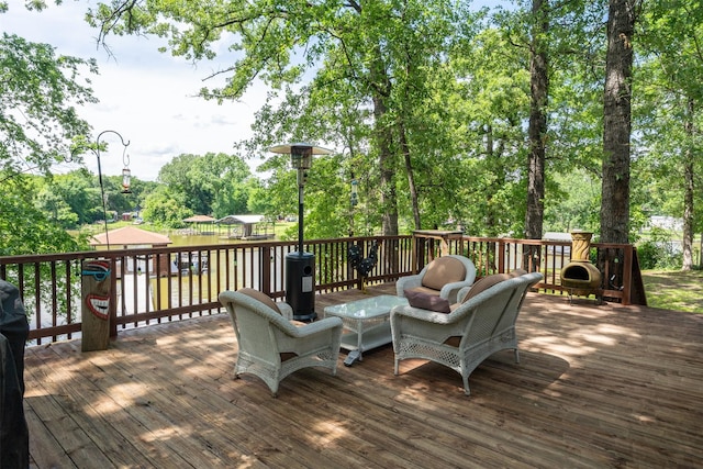 237 Ben Lacy Dr, Gun Barrel City, TX 75156 - deck with an outdoor living space and view of wooded area