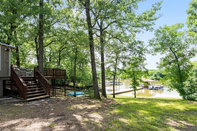 237 Ben Lacy Dr, Gun Barrel City, TX 75156 - view of yard with stairway, a boat dock, and a deck with water view