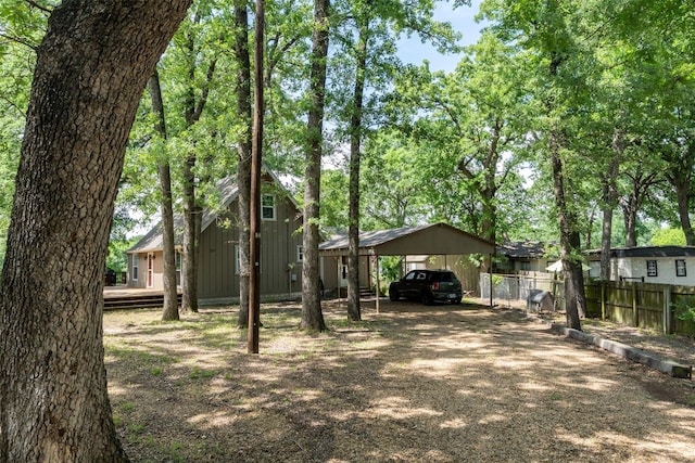 237 Ben Lacy Dr, Gun Barrel City, TX 75156 - view of front of home with a detached carport, fence, and dirt driveway