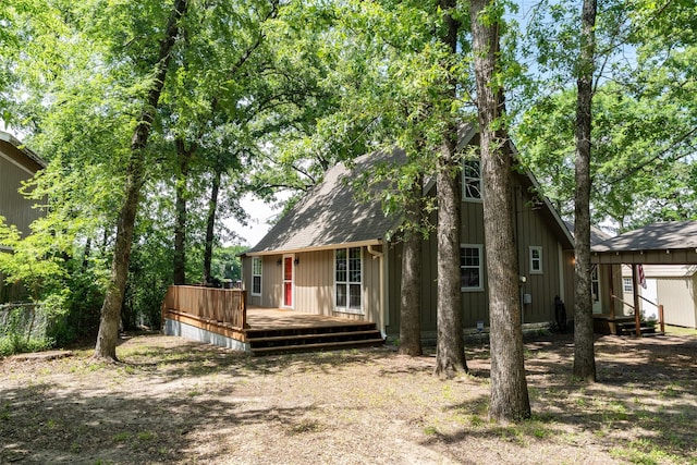 237 Ben Lacy Dr, Gun Barrel City, TX 75156 - back of property with a deck, roof with shingles, and fence