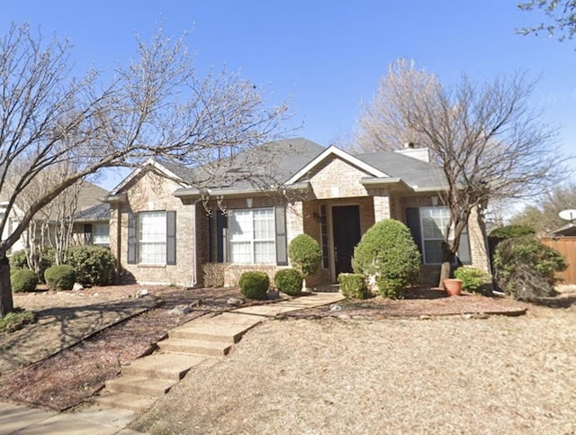 single story home with brick siding