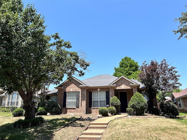10908 Brandenberg Dr, Frisco, TX 75035 - single story home with brick siding, a front yard, and a shingled roof
