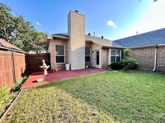 10908 Brandenberg Dr, Frisco, TX 75035 - back of house with brick siding, a patio area, a chimney, and roof with shingles