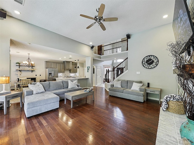 611 Falling Leaf Dr, Allen, TX 75002 - living area with ceiling fan, a chandelier, wood-type flooring, a textured ceiling, and stairs