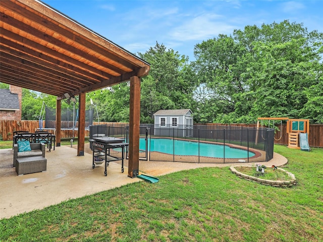 611 Falling Leaf Dr, Allen, TX 75002 - view of swimming pool featuring a trampoline, a playground, a patio area, a storage shed, and an outbuilding