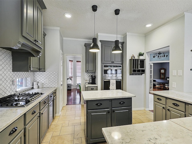 611 Falling Leaf Dr, Allen, TX 75002 - kitchen featuring stainless steel appliances, ornamental molding, tasteful backsplash, a center island, and decorative light fixtures