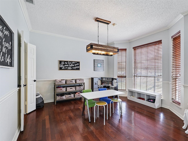 611 Falling Leaf Dr, Allen, TX 75002 - playroom featuring wood finished floors, a textured ceiling, baseboards, and crown molding
