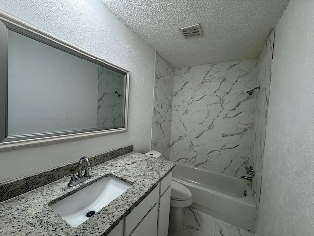 1029 Fox River Ln, Fort Worth, TX 76120 - bathroom featuring marble look tile flooring, toilet, a textured ceiling, vanity, and shower / bathtub combination