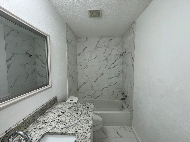 1029 Fox River Ln, Fort Worth, TX 76120 - bathroom with toilet, a textured ceiling, marble look tile flooring, vanity, and  shower combination