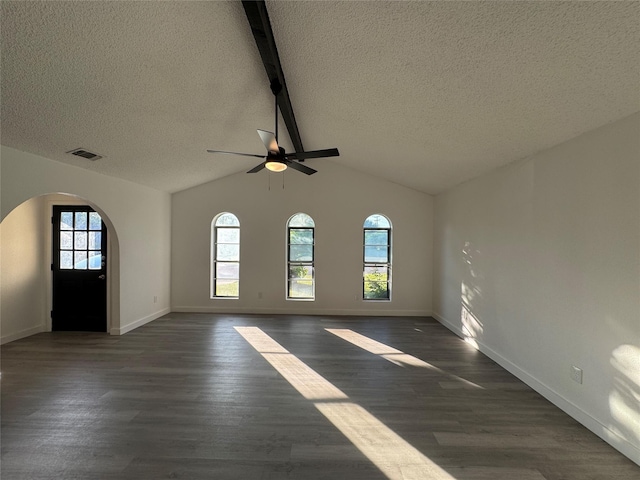 1029 Fox River Ln, Fort Worth, TX 76120 - unfurnished living room with arched walkways, ceiling fan, a textured ceiling, dark wood-type flooring, and baseboards