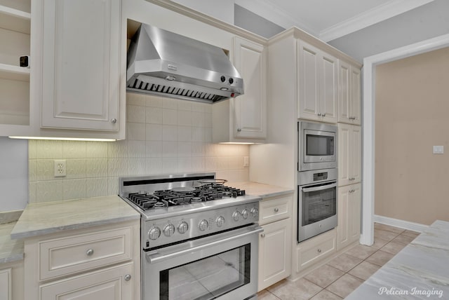 11911 Longfellow Cir, Shreveport, LA 71106 - kitchen featuring stainless steel appliances, wall chimney exhaust hood, ornamental molding, backsplash, and light stone countertops
