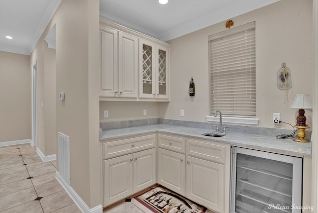 11911 Longfellow Cir, Shreveport, LA 71106 - bar area featuring wine cooler, a sink, crown molding, recessed lighting, and light tile patterned floors