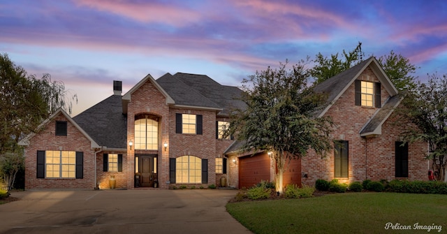 11911 Longfellow Cir, Shreveport, LA 71106 - traditional-style house featuring driveway, brick siding, a garage, a chimney, and a front yard