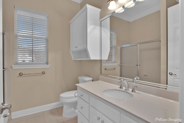 11911 Longfellow Cir, Shreveport, LA 71106 - full bath featuring tile patterned floors, baseboards, vanity, toilet, and a shower with door