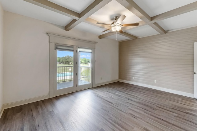 8511 Westover Ct Unit 235, Granbury, TX 76049 - empty room featuring coffered ceiling, baseboards, beamed ceiling, wood finished floors, and a ceiling fan