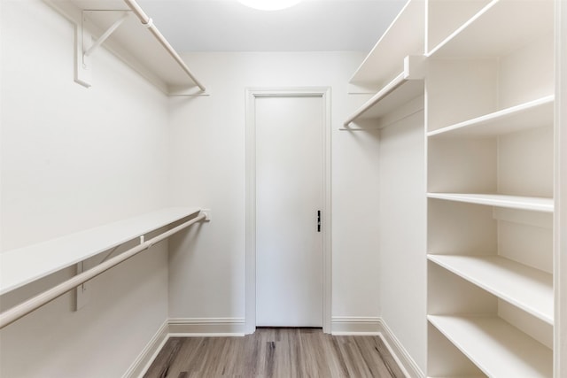 8511 Westover Ct Unit 235, Granbury, TX 76049 - walk in closet featuring wood finished floors