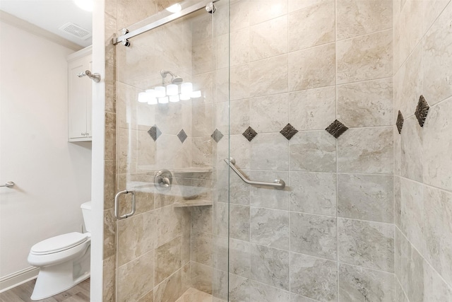 8511 Westover Ct Unit 235, Granbury, TX 76049 - full bath with a stall shower, toilet, and wood finished floors