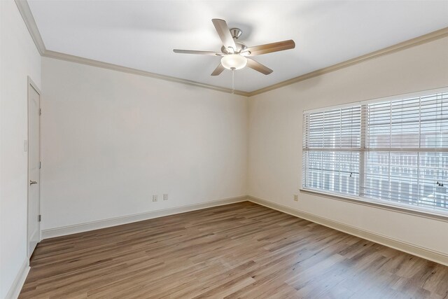 8511 Westover Ct Unit 235, Granbury, TX 76049 - unfurnished room with crown molding, light wood finished floors, a ceiling fan, and baseboards