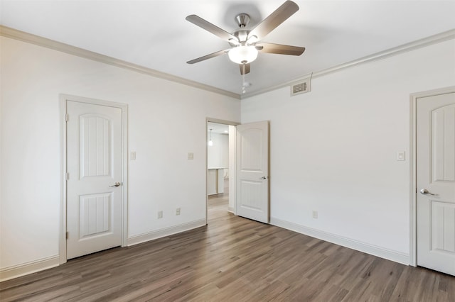 8511 Westover Ct Unit 235, Granbury, TX 76049 - unfurnished bedroom with wood finished floors, crown molding, baseboards, and a ceiling fan