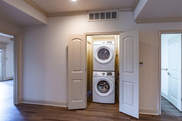 8511 Westover Ct Unit 235, Granbury, TX 76049 - clothes washing area with stacked washer / drying machine, ornamental molding, wood finished floors, and baseboards