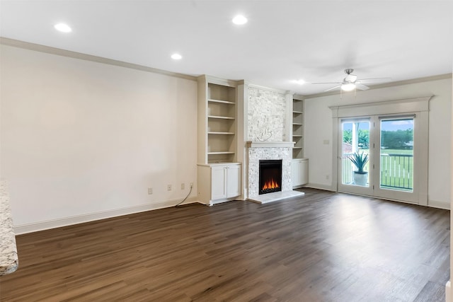 8511 Westover Ct Unit 235, Granbury, TX 76049 - unfurnished living room featuring a fireplace, ceiling fan, dark wood-style flooring, baseboards, and recessed lighting