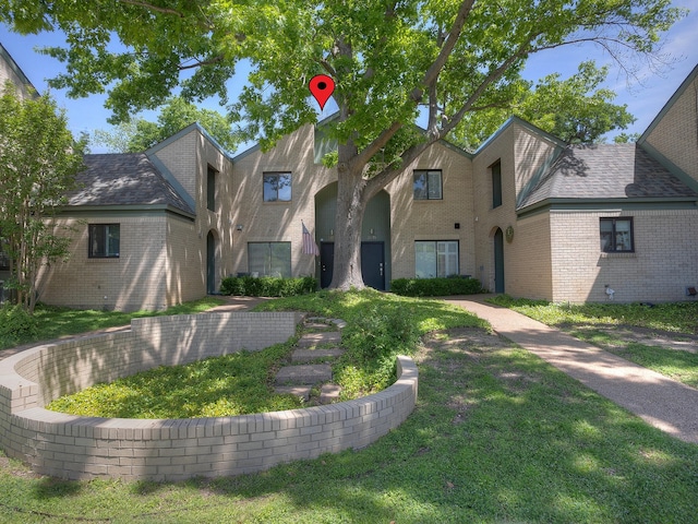 2633 Mccart Ave, Fort Worth, TX 76110 - view of front of house with brick siding and a front lawn