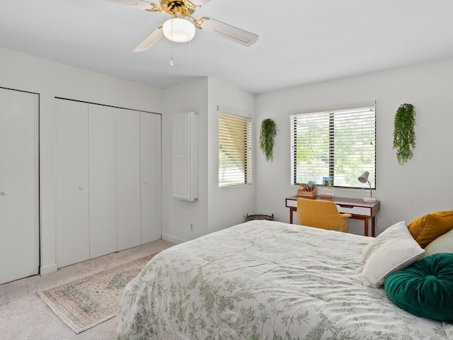 2633 Mccart Ave, Fort Worth, TX 76110 - carpeted bedroom with ceiling fan and two closets