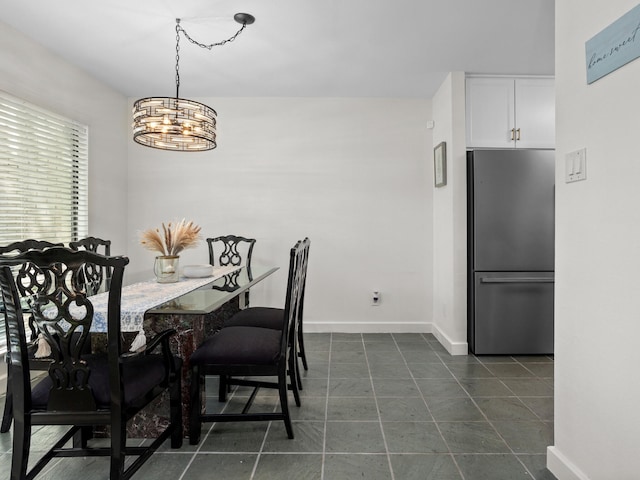 2633 Mccart Ave, Fort Worth, TX 76110 - dining area with a chandelier and baseboards