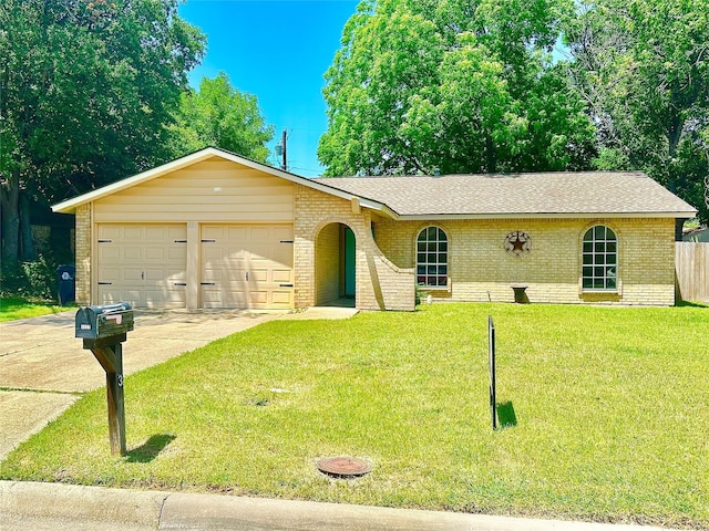 3317 Hummingbird, Denton, TX 76209 - single story home with brick siding, driveway, an attached garage, and roof with shingles