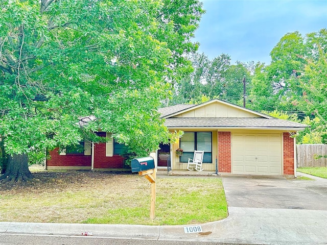 1008 Sierra Dr, Denton, TX 76209 - view of front facade featuring concrete driveway, an attached garage, a porch, and brick siding