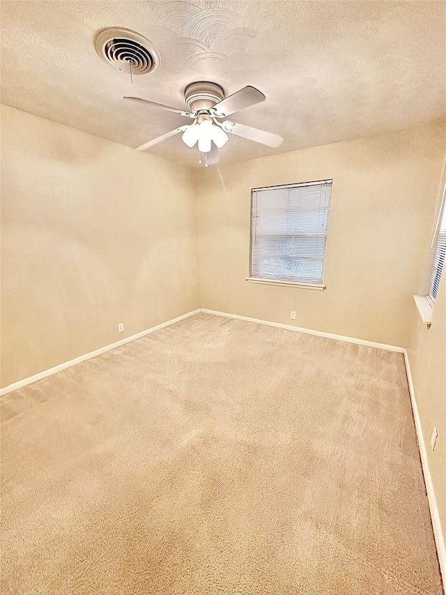 1008 Sierra Dr, Denton, TX 76209 - spare room featuring carpet flooring, baseboards, and a ceiling fan