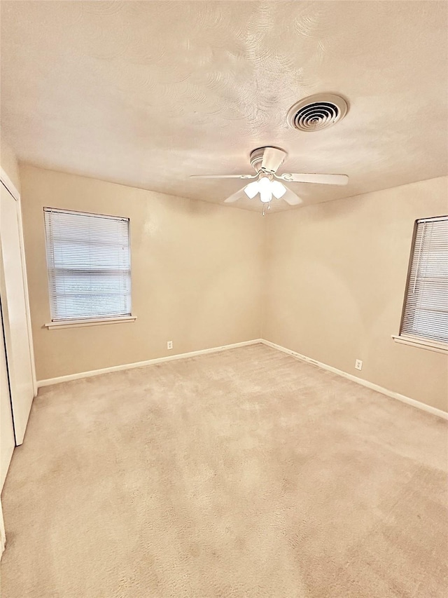 1008 Sierra Dr, Denton, TX 76209 - empty room with baseboards, a ceiling fan, and light colored carpet