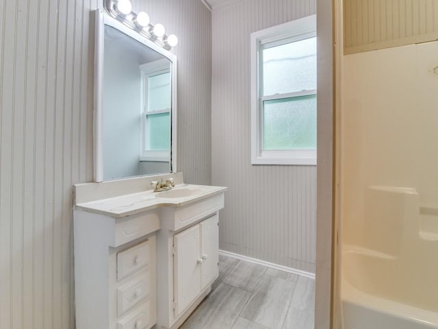 500 N Virginia St, Terrell, TX 75160 - bathroom featuring vanity, wallpapered walls, and baseboards