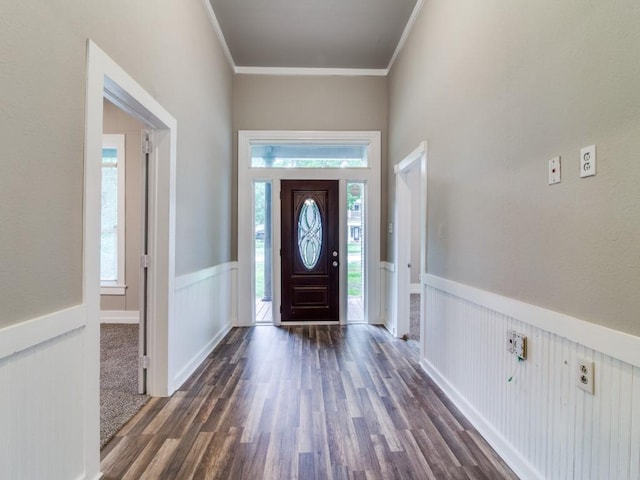 500 N Virginia St, Terrell, TX 75160 - foyer featuring dark wood finished floors, a wainscoted wall, and ornamental molding