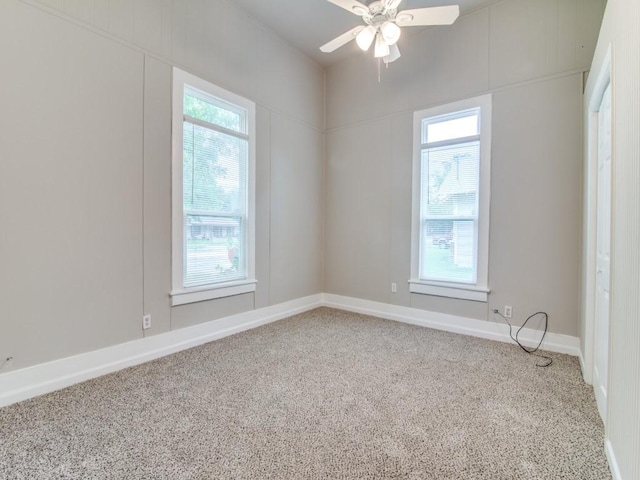 500 N Virginia St, Terrell, TX 75160 - empty room with carpet flooring, healthy amount of natural light, ceiling fan, and baseboards