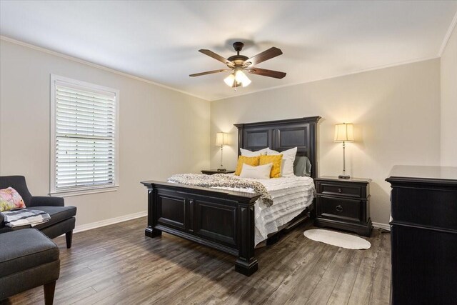 807 Berger Rd, West, TX 76691 - bedroom featuring dark wood-style floors, crown molding, baseboards, and a ceiling fan