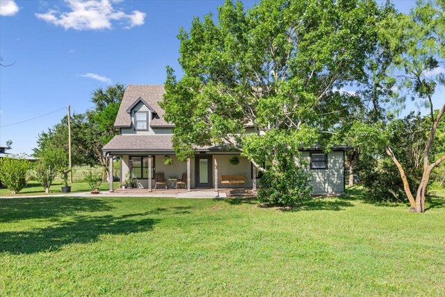 807 Berger Rd, West, TX 76691 - back of house with a yard and roof with shingles