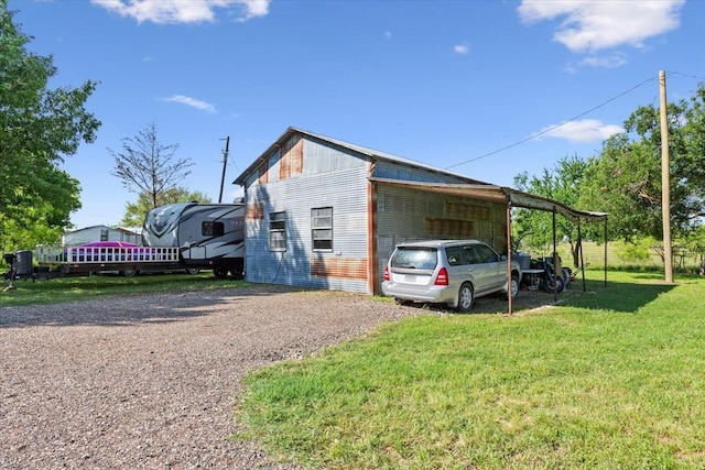 807 Berger Rd, West, TX 76691 - view of home's exterior with driveway, a yard, and a carport