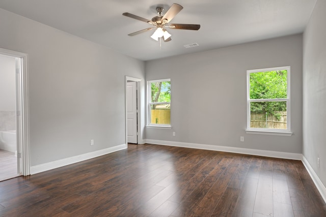 1729 Foster Dr, Arlington, TX 76012 - spare room with baseboards, a ceiling fan, and dark wood-style floors