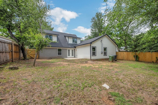 1729 Foster Dr, Arlington, TX 76012 - back of property with french doors and roof with shingles